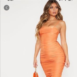 Orange ruched maxi dress